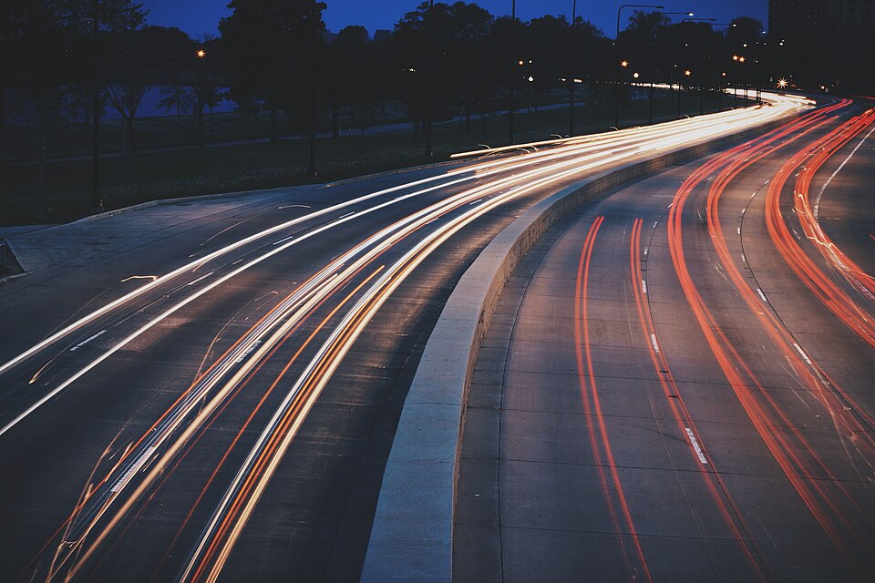 Highway at night with light trails